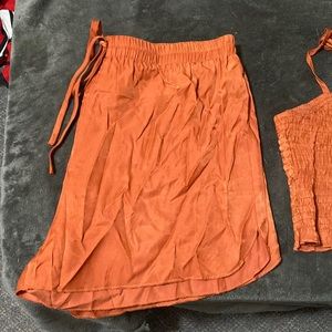 A 2 piece burnt orange crop top set